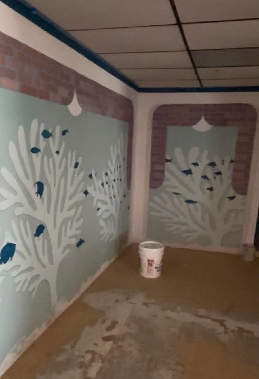 Hand-painted coral murals in the dining room